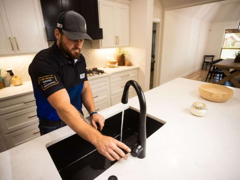 Plumber in Owasso, OK, fixing low water pressure in sink