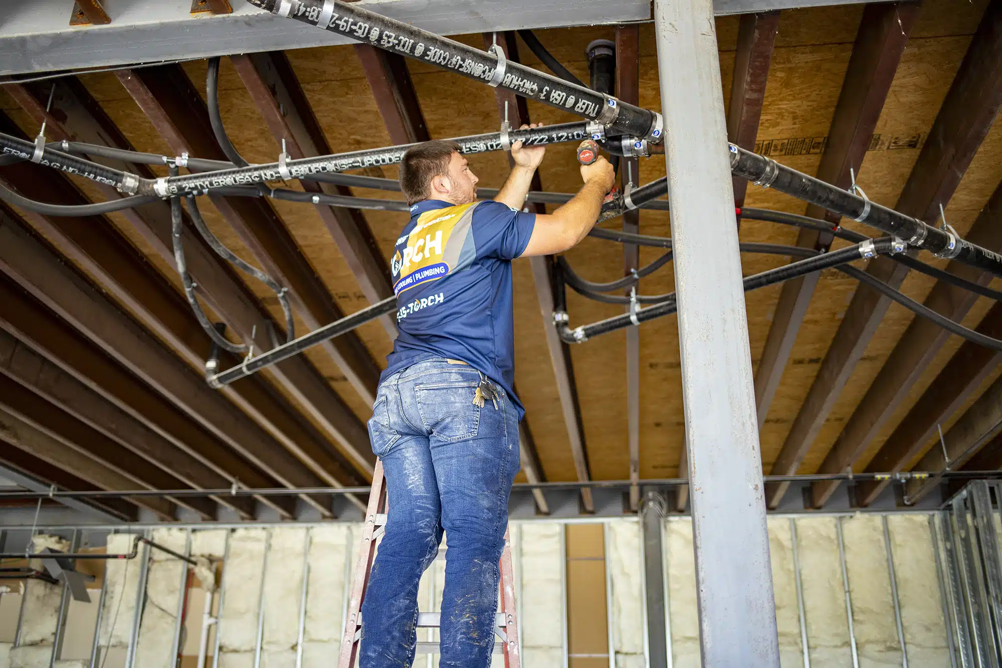 Plumber in Owasso, OK, installing pipes